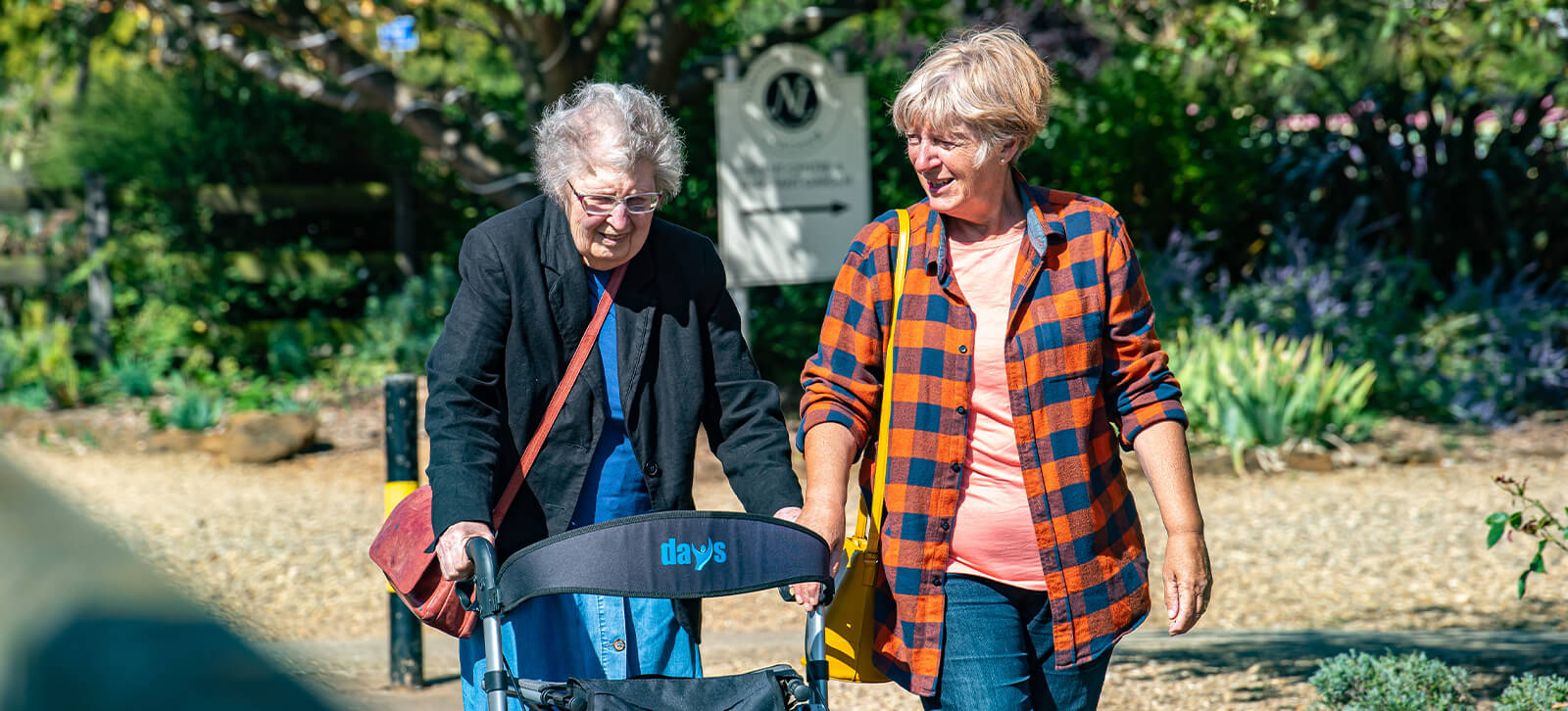 Two ladies out for a walk enjoying the sunshine