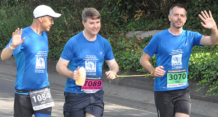 3 Men running a marathon