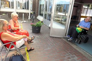 Thomas Tawell House resident Maurice Sadd chats with his sisters