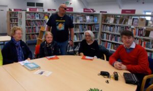Members of the Gaywood audio book club meeting on World Book Day