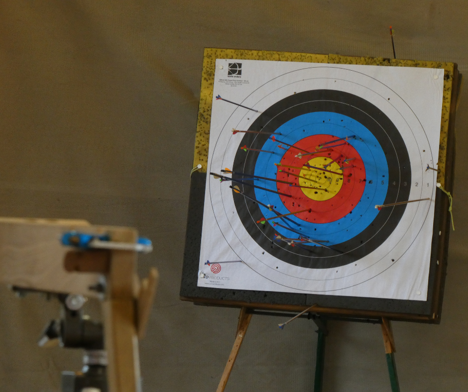 Close up of archery target covered with arrows