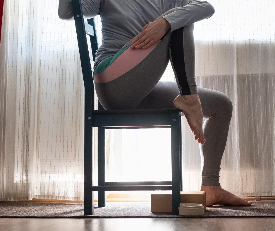 Person stretching on a chair in excersise leggings