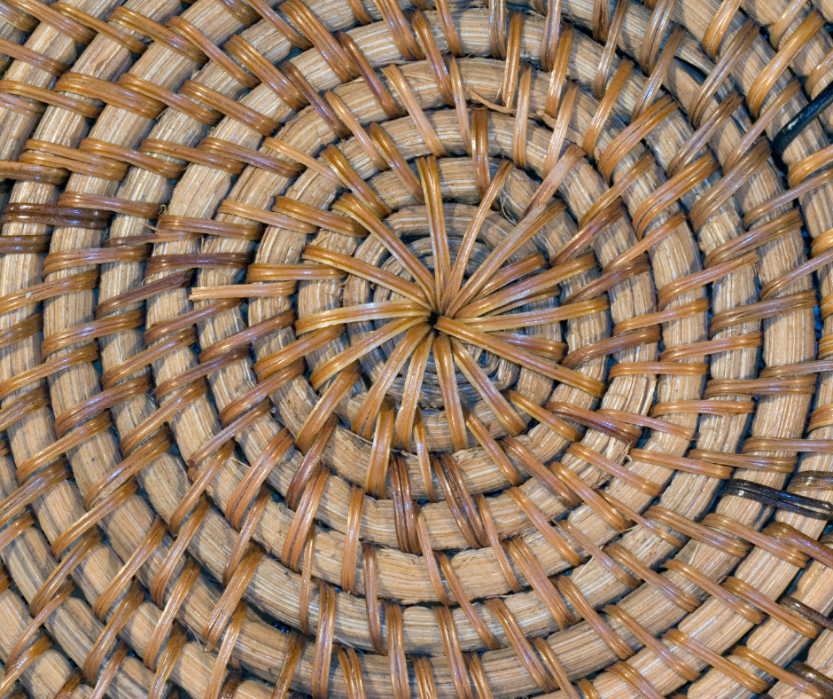 Close up of the bottom of a weaved basket showing the circular pattern