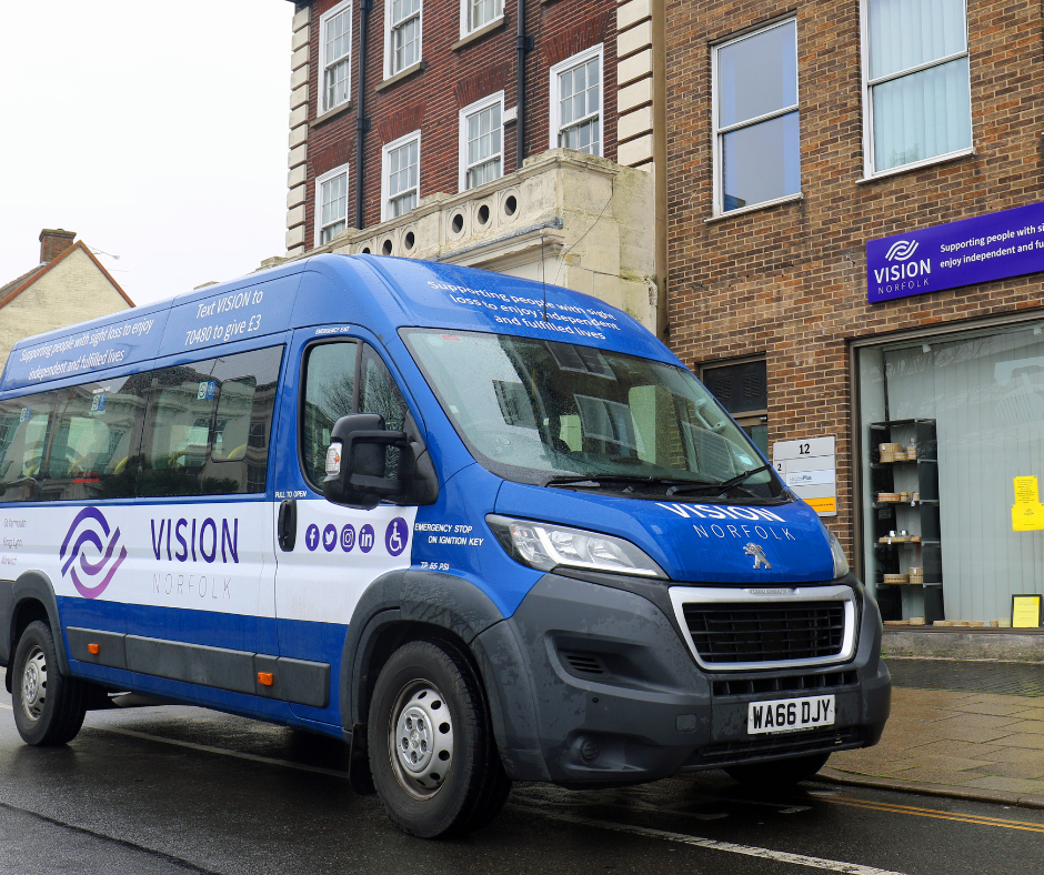 A blue and white Vision Norfolk van parked outside the Great Yarmouth hub