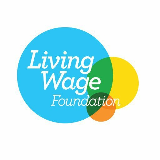 The logo for the Living Wage foundation consisiting of 3 overlapping circles in blue, yellow and orange and the white text "Living Wage Foundation".