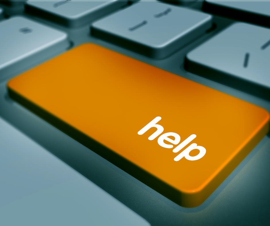 Large orange key on a computer keyboard with the word "help" on it.