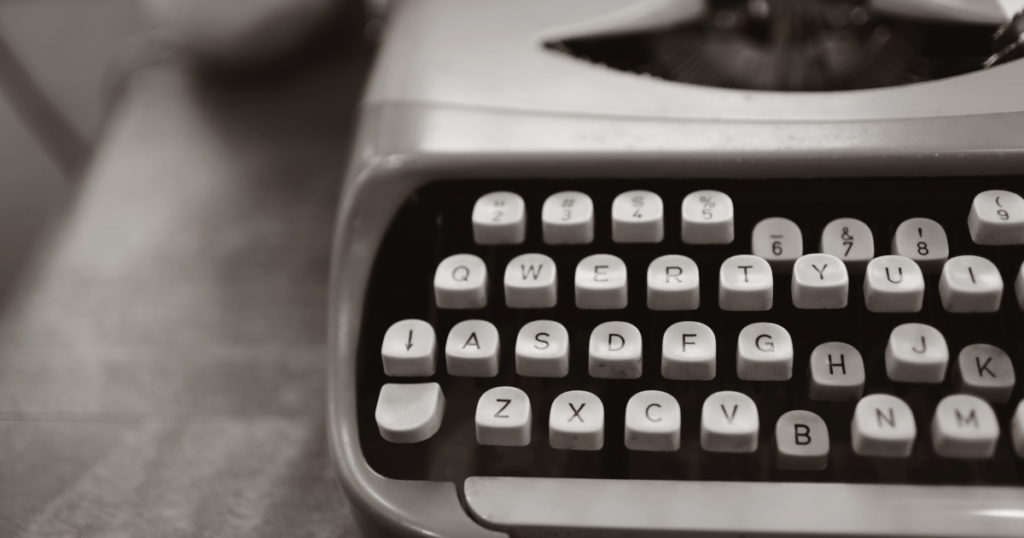 Close up of the keyboard of a gray typewriter.