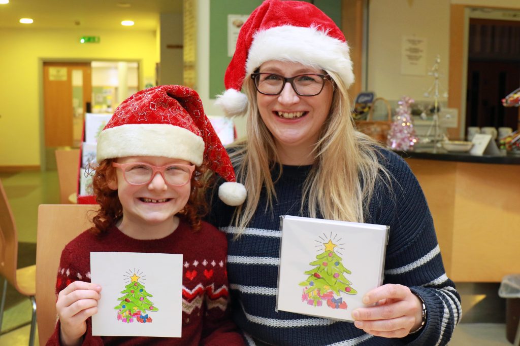Rhiannon Kay and her mum Teresa Bell with Rhiannon's charity Christmas card design