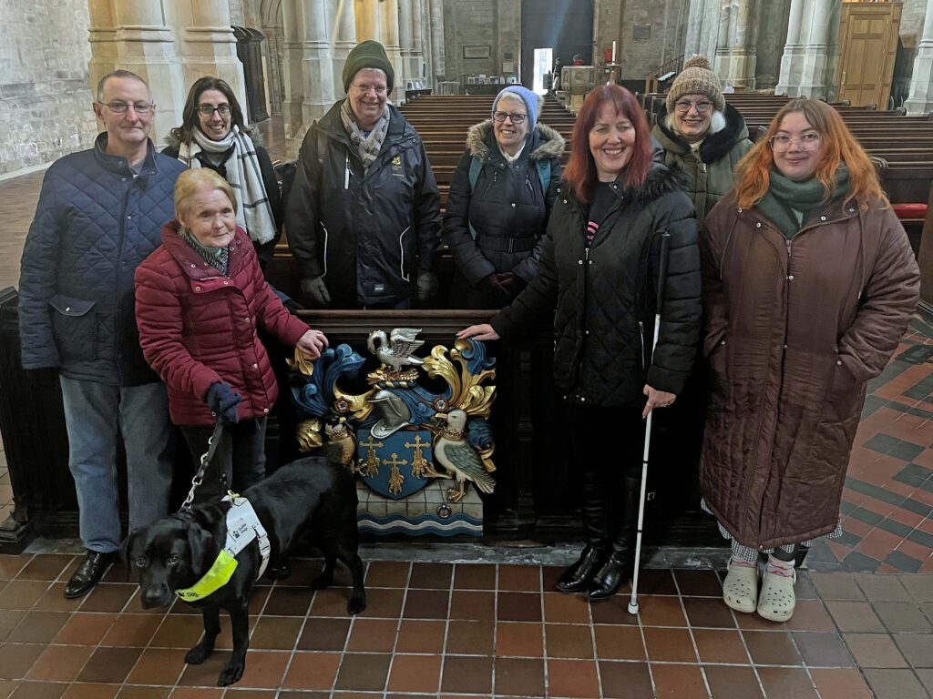 A group of vision impaired people explore King's Lynn's Minster