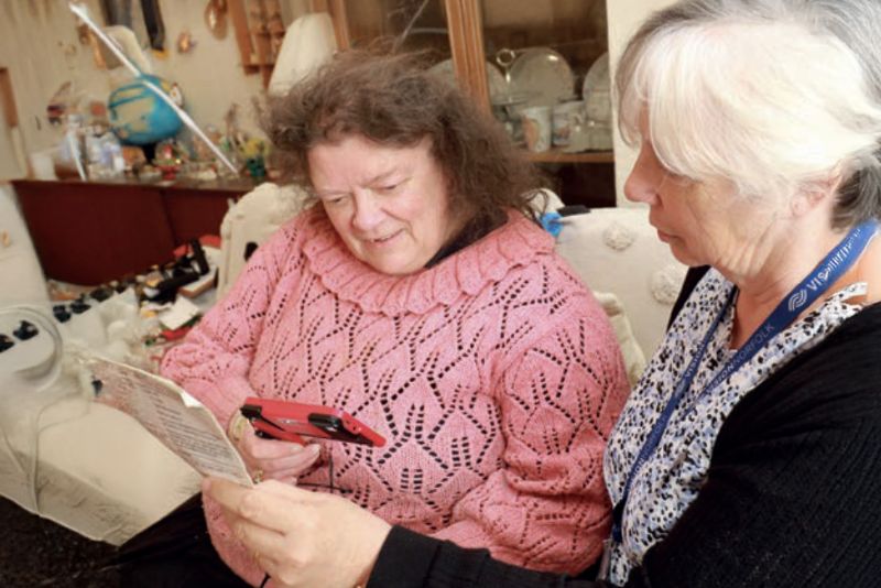 Sue, one of our Community Outreach Workers helps Denyse get to grips with assistive technology in her own home.