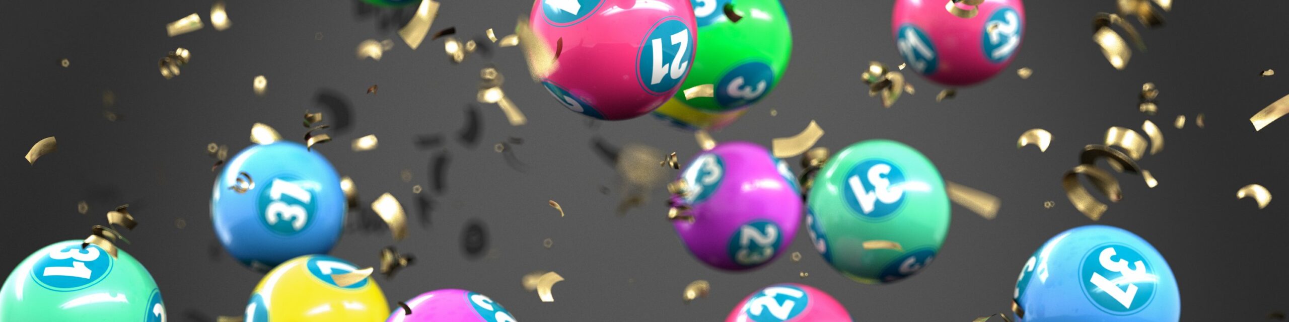 A stylised image of multicoloured lottery balls and gold confetti.