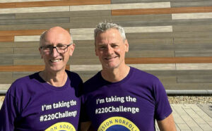 Vision impaired runner Chris Waller (right) with guide Ade Dyde