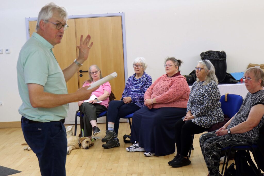 Conductor James Fowler leads a rehearsal of the Vision Norfolk Norwich choir
