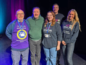 Comedian Chris McCausland with Vision Norfolk staff at King's Lynn Corn Exchange